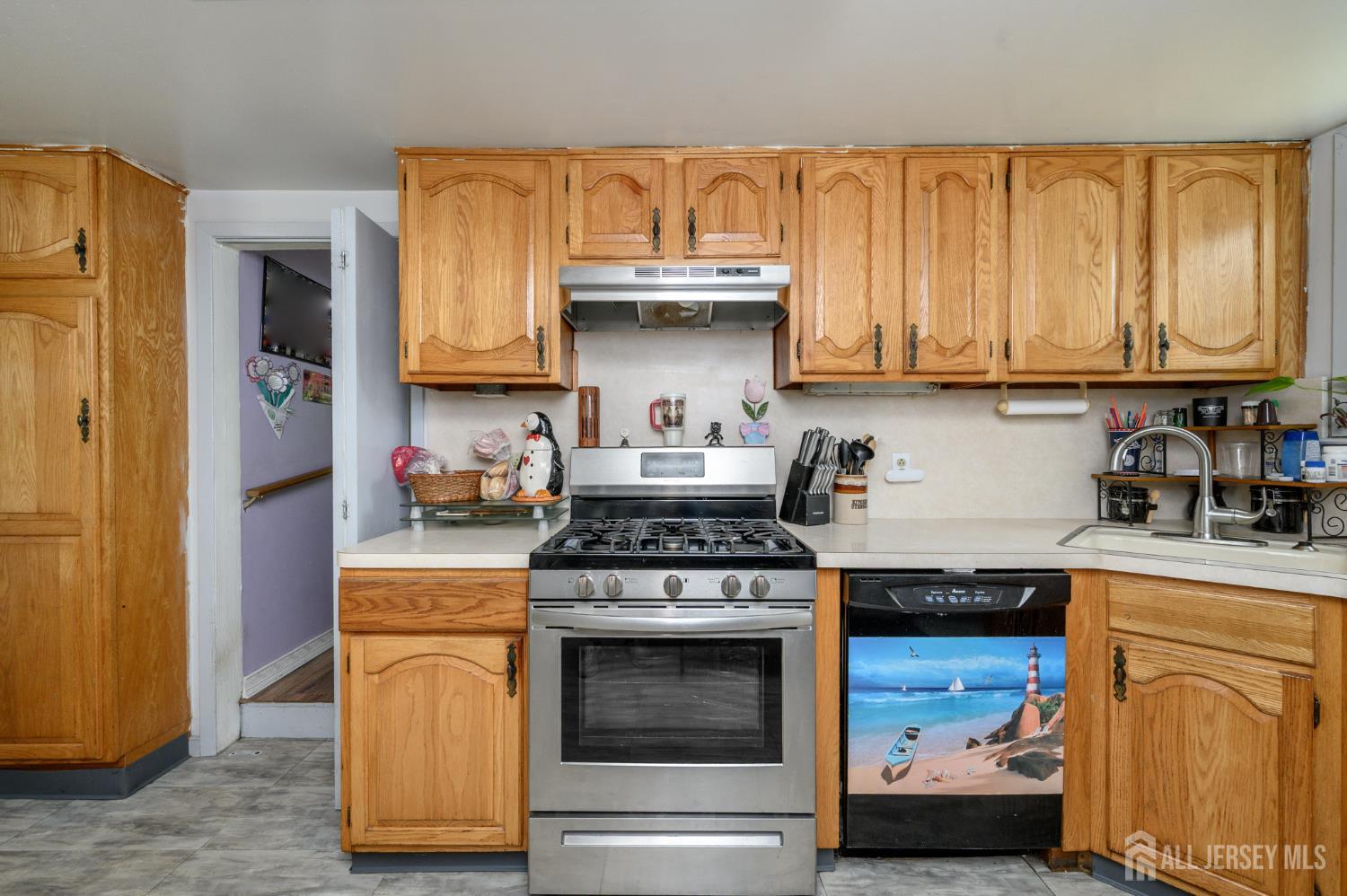 1650 Holly Road North Brunswick, NJ 08902 - Photo 14 of 41 a kitchen with stainless steel appliances granite countertop a stove and a refrigerator