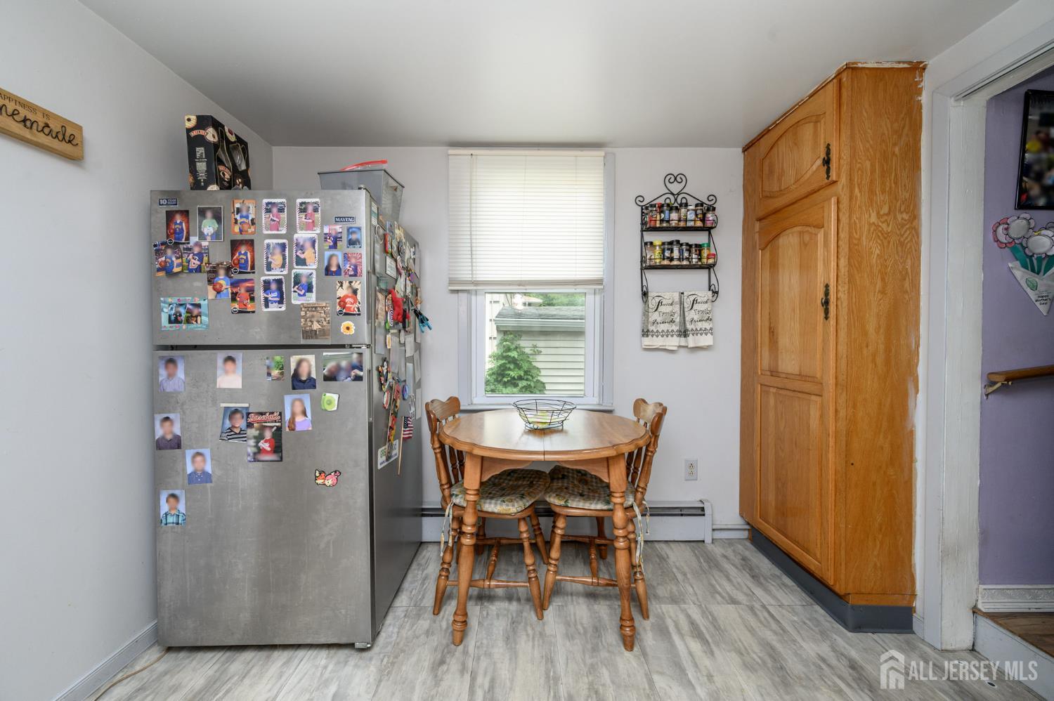 1650 Holly Road North Brunswick, NJ 08902 - Photo 18 of 41 a view of a dining room with furniture window and outside view