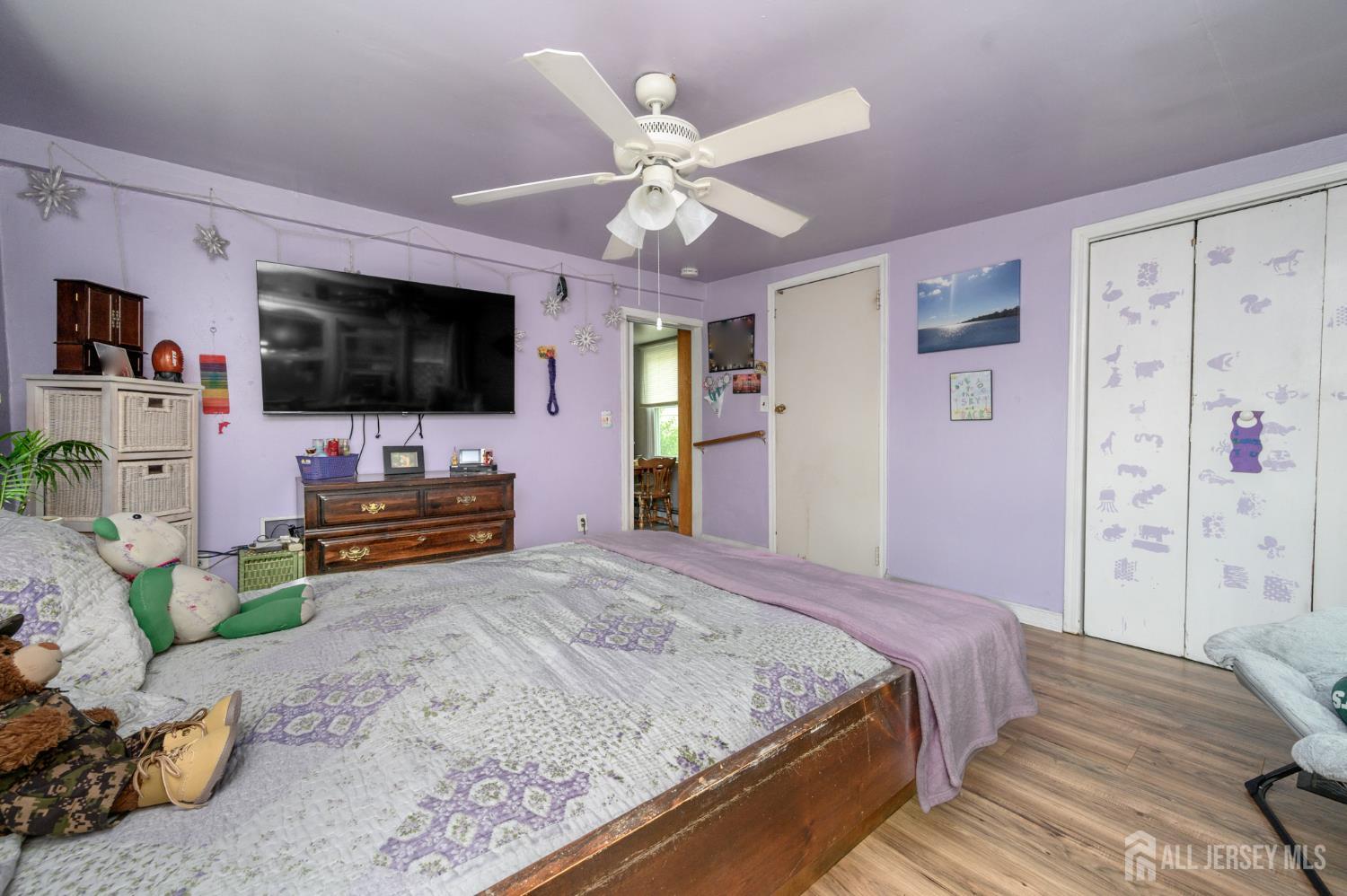 1650 Holly Road North Brunswick, NJ 08902 - Photo 20 of 41 a bedroom with a bed and a flat screen tv