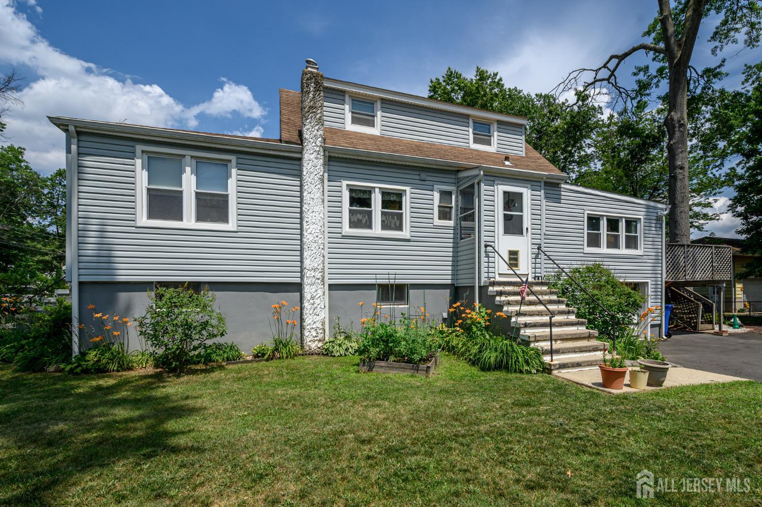 1650 Holly Road North Brunswick, NJ 08902 - Photo 2 of 41 a front view of a house with a yard