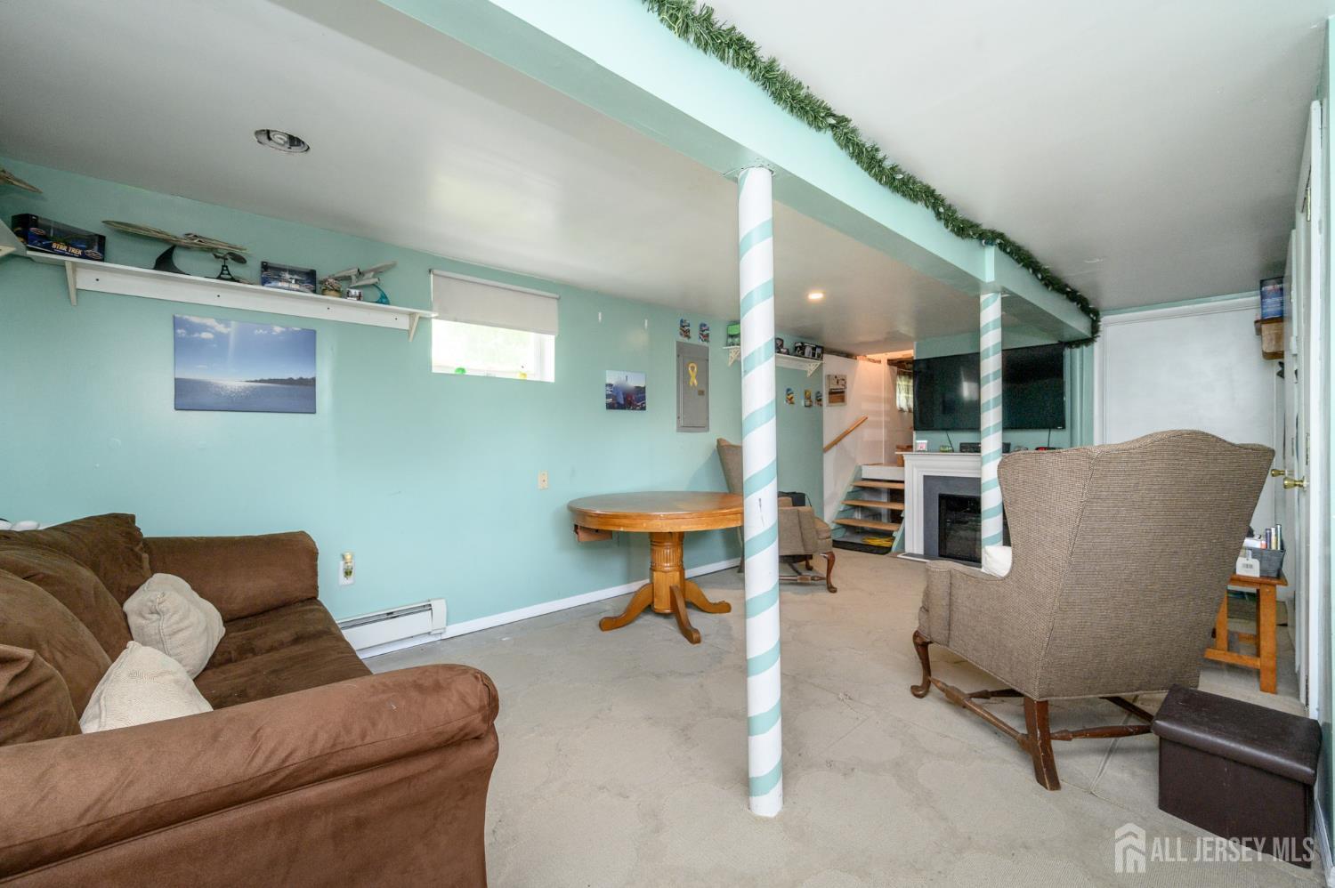 1650 Holly Road North Brunswick, NJ 08902 - Photo 26 of 41 a living room with furniture and a wooden floor