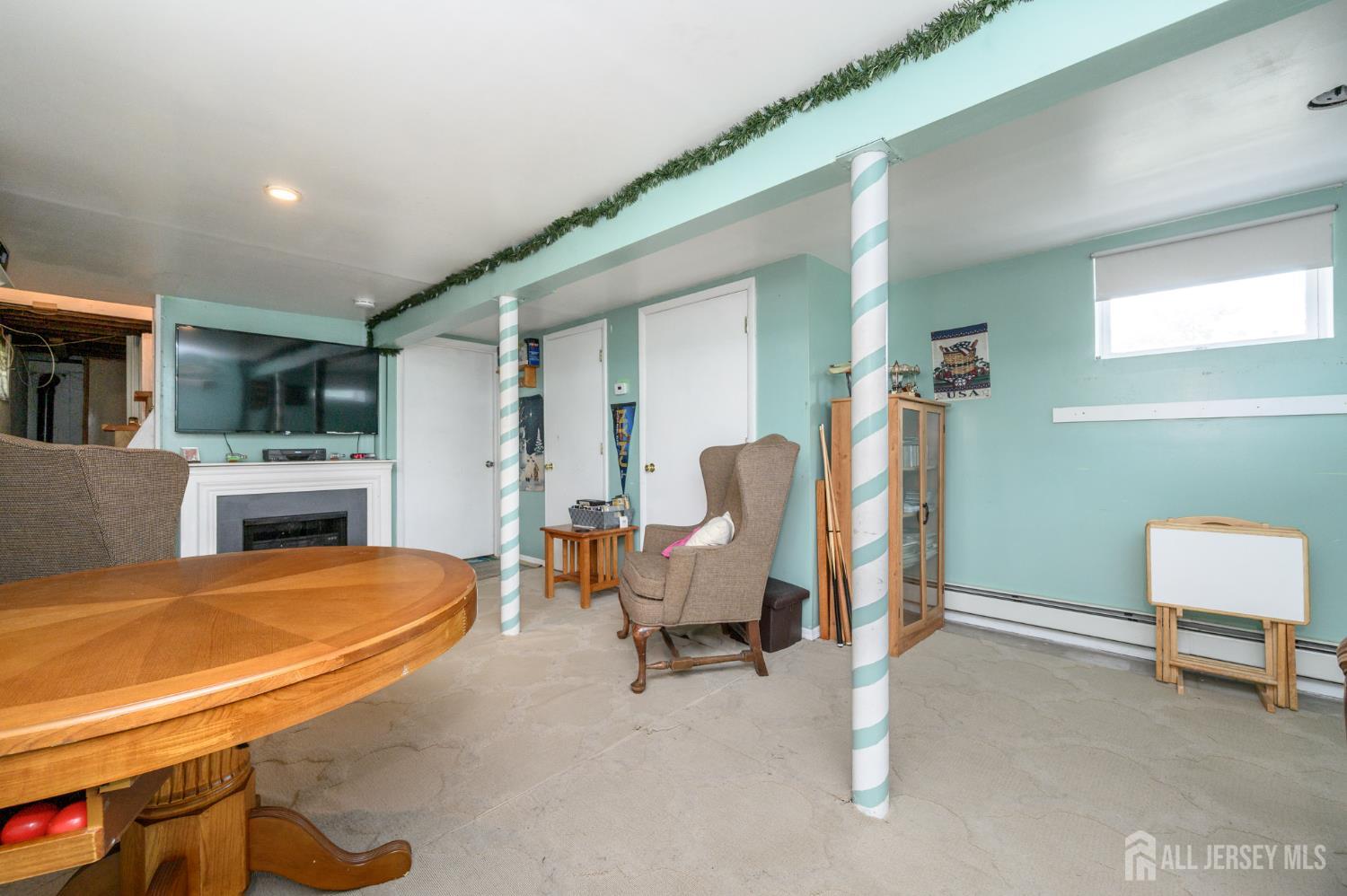 1650 Holly Road North Brunswick, NJ 08902 - Photo 27 of 41 a view of a livingroom with furniture and a kitchen