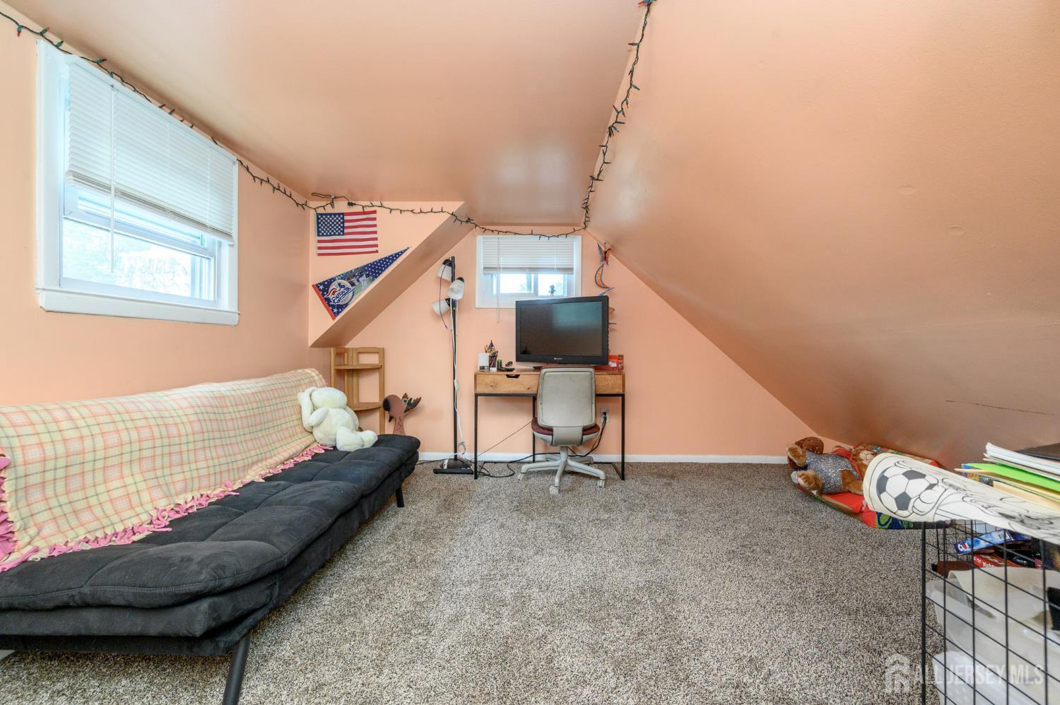 1650 Holly Road North Brunswick, NJ 08902 - Photo 29 of 41 a living room with furniture and stairs