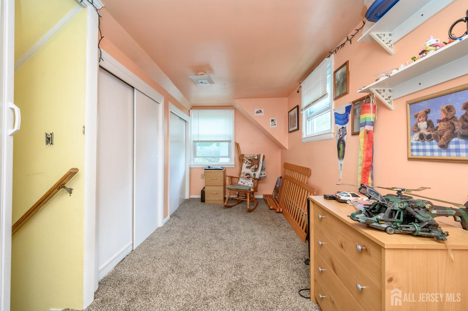 1650 Holly Road North Brunswick, NJ 08902 - Photo 31 of 41 a hallway with a table and chairs
