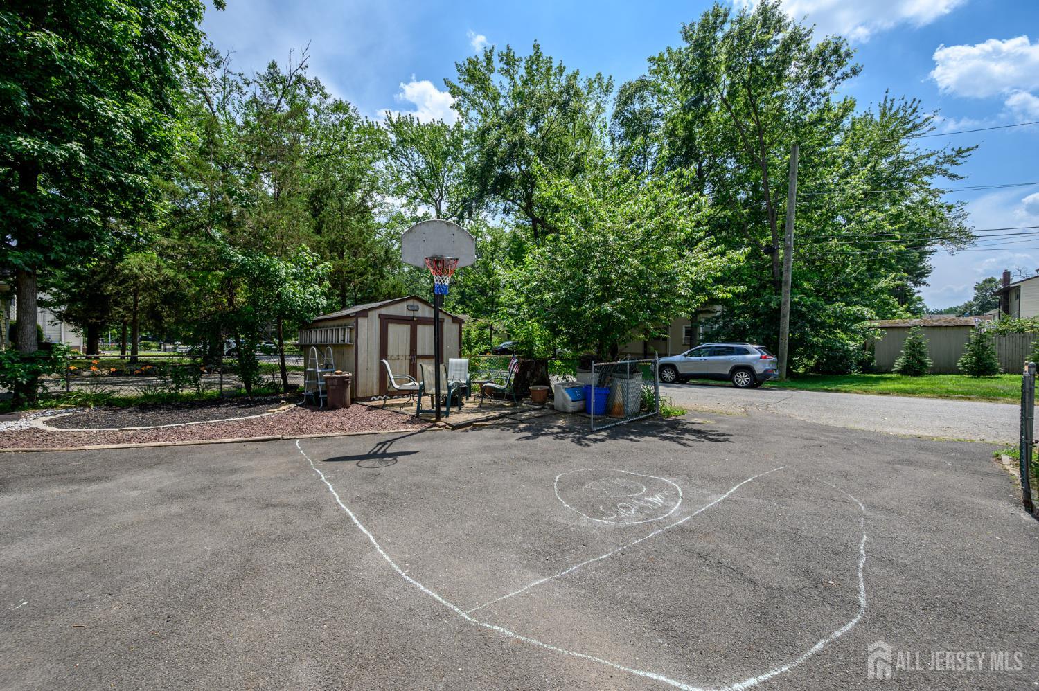 1650 Holly Road North Brunswick, NJ 08902 - Photo 34 of 41 a view of a house with a yard and garage