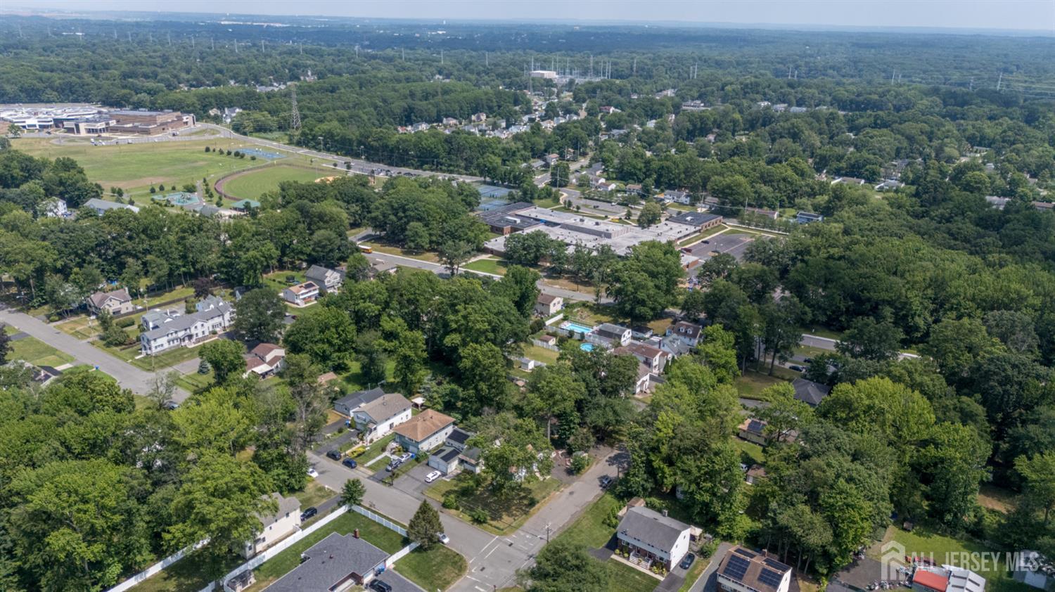 1650 Holly Road North Brunswick, NJ 08902 - Photo 40 of 41 an aerial view of residential house with outdoor space and trees