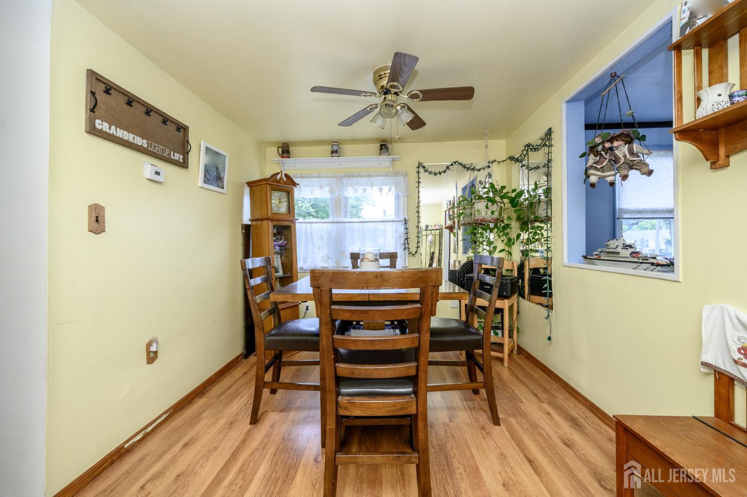 1650 Holly Road North Brunswick, NJ 08902 - Photo 10 of 41 a view of a dining room with furniture window and wooden floor