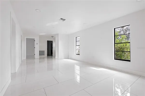 a view of an empty room with a window