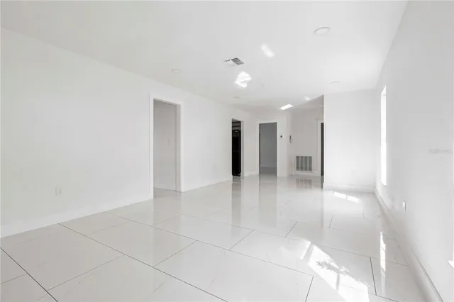 a view of a hallway with a bathroom