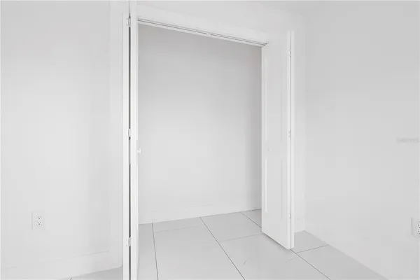 a kitchen with a sink dishwasher and a stove with wooden cabinet