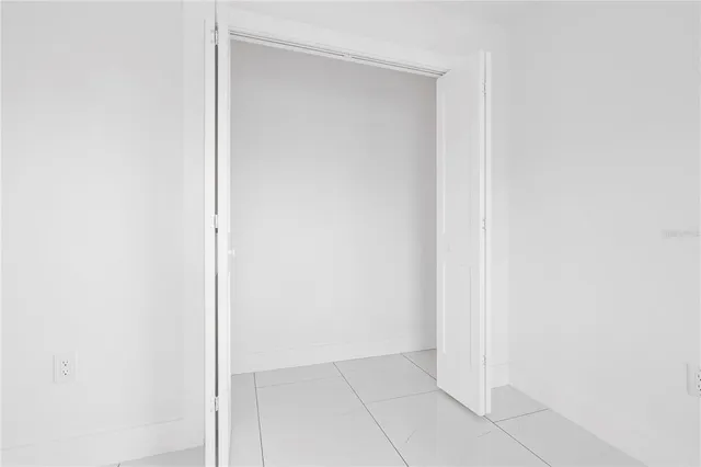 a kitchen with a sink dishwasher and a stove with wooden cabinet