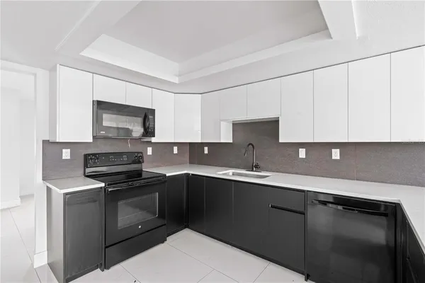 a kitchen with a sink and a refrigerator