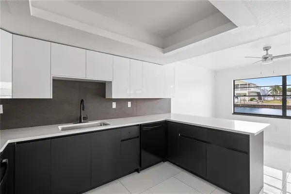 a kitchen with appliances and cabinets