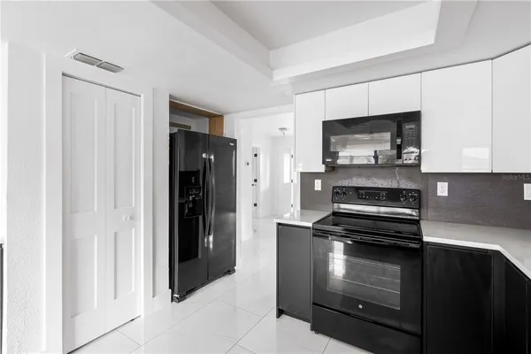 a view of a kitchen with a sink and dishwasher