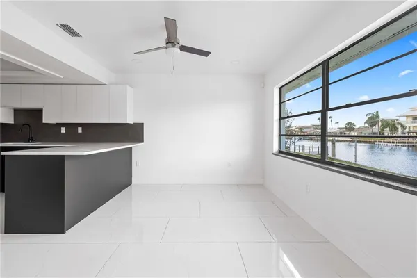 a view of a kitchen with electric appliances