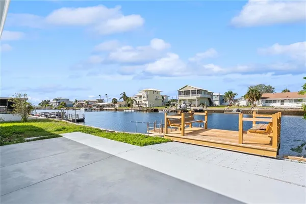 an aerial view of a house with a lake view