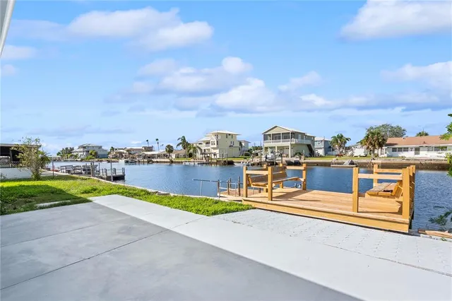 an aerial view of a house with a lake view