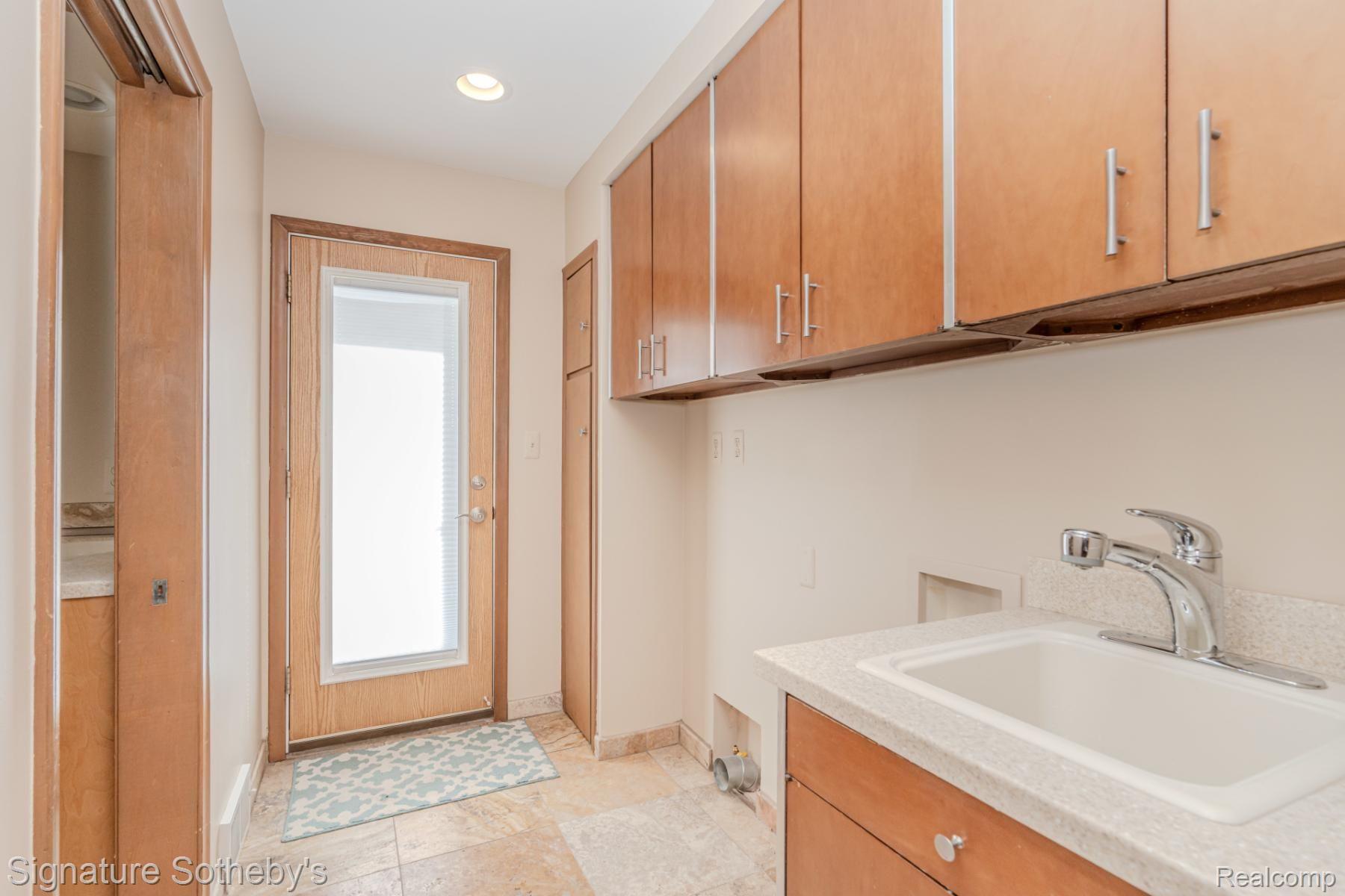 11416 East 13 Mile Road Warren, MI 48093 - Photo 25 of 94 Laundry room with door to rear yard