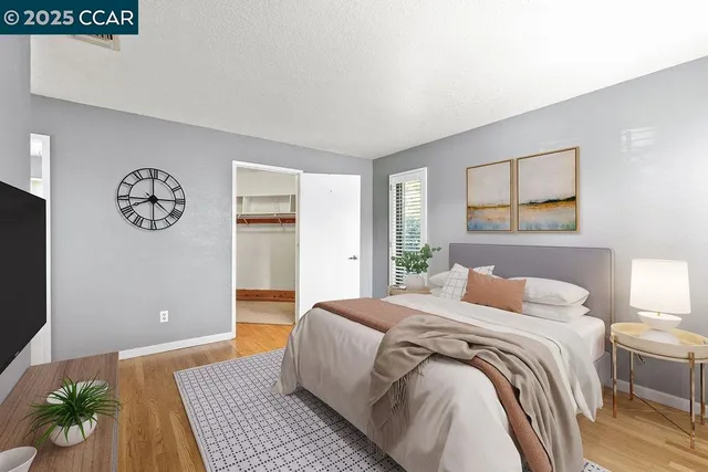 a bedroom with a large bed and a window