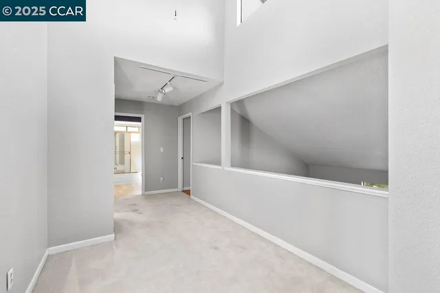 an empty room with windows