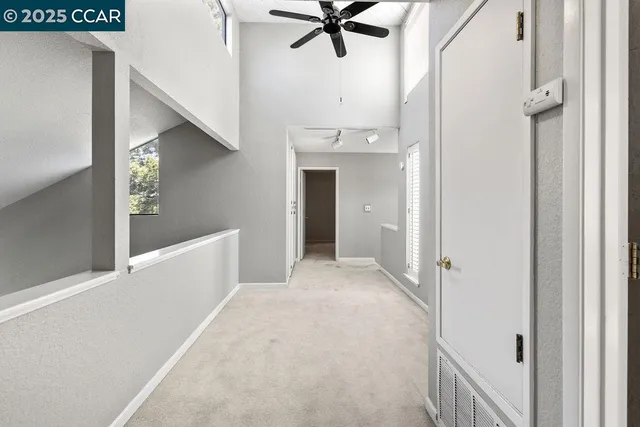 a view of a hallway view with staircase