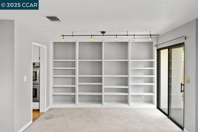 a view of an empty walk in closet