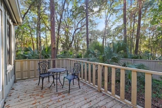 5324 Southwest 88 Court Gainesville, FL 32608 - Photo 19 of 21 a view of balcony with furniture and trees