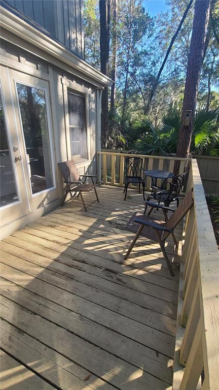 5324 Southwest 88 Court Gainesville, FL 32608 - Photo 20 of 21 a view of a house with backyard sitting area and garden
