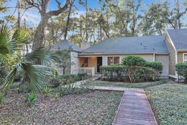 5324 Southwest 88 Court Gainesville, FL 32608 - Photo 2 of 21 a front view of a house with garden