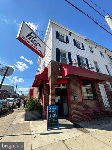 a front view of a building with parking space