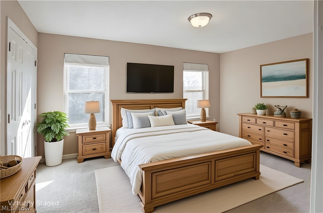 11768 Valley View Road Northfield, OH 44067 - Photo 25 of 45 Bedroom with light colored carpet and a closet