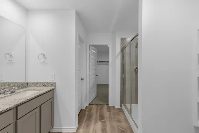 a view of a bathroom from a hallway