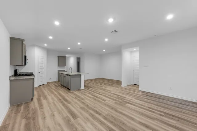 a kitchen with a sink cabinets and stainless steel appliances