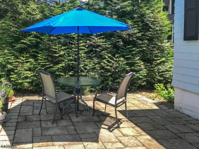 a chair and table in the patio