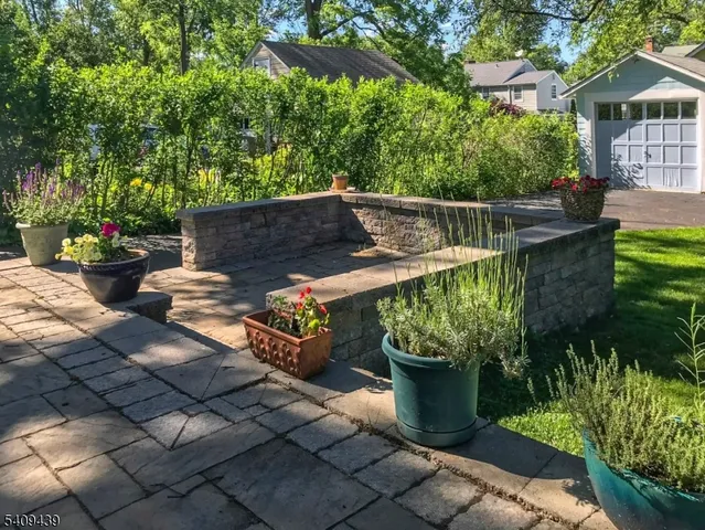 a view of a backyard with sitting area