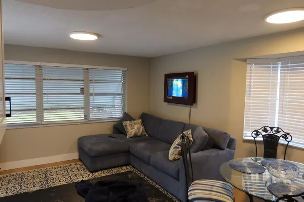 a living room with furniture and a window