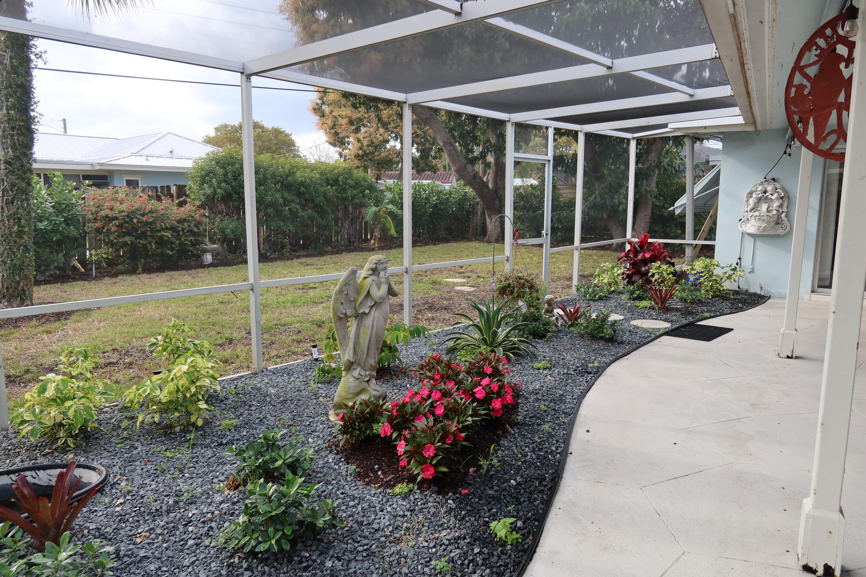 1001 Southwest 12th Terrace Boca Raton, FL 33486 - Photo 9 of 13 a view of a garden with patio