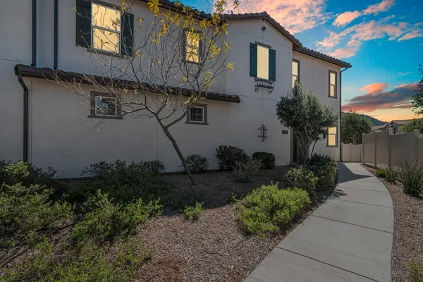 a house view with a garden space