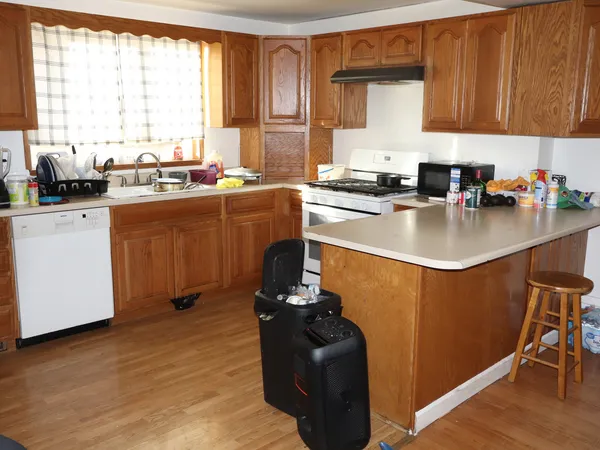 an empty room with wooden floor