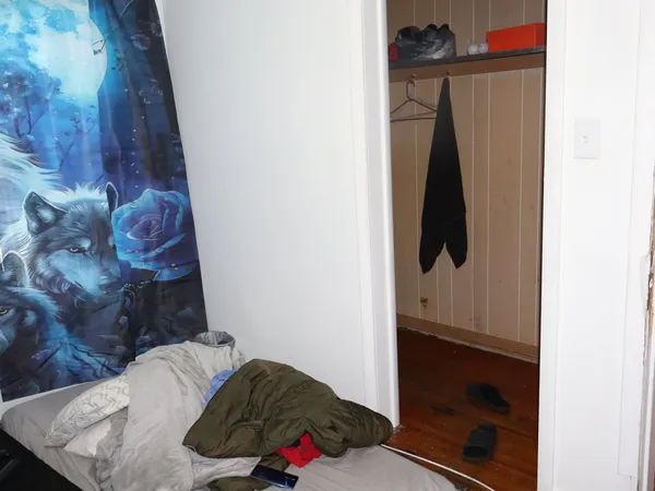 a view of walk in closet with clothes