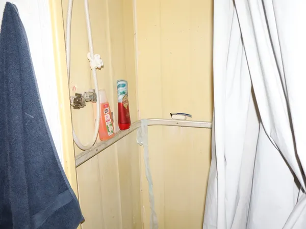 a bedroom with a bed and cabinets