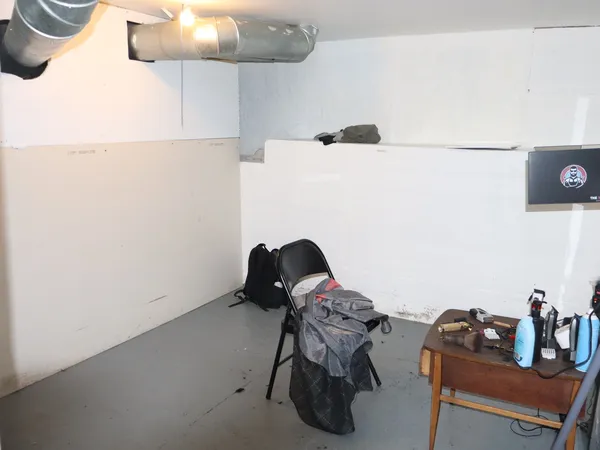 a living room with furniture and a mirror