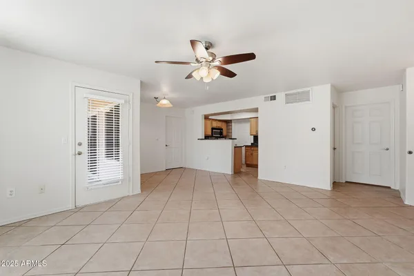 a view of an empty room with a window