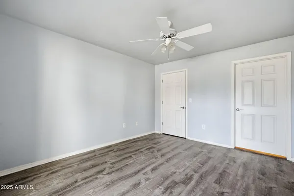a view of an entryway with wooden floor