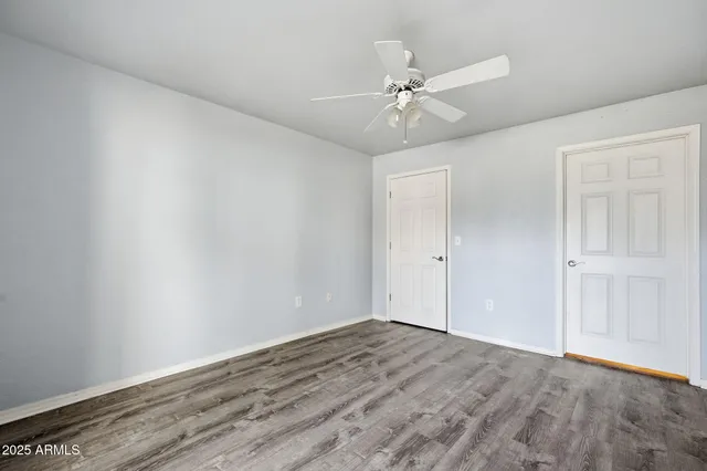 a view of an entryway with wooden floor