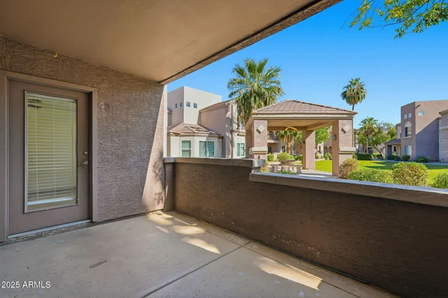 a view of balcony with furniture