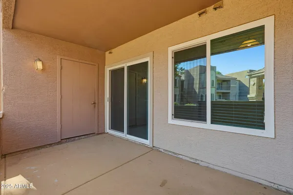 a view of backyard with large windows