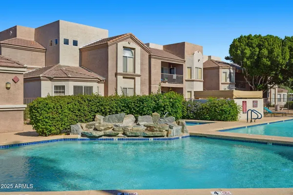 a front view of a house with a yard table and chairs