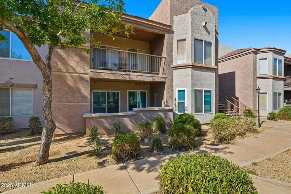 a front view of house with yard and outdoor seating