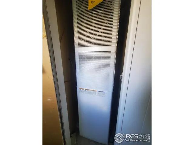 a bathroom with a toilet and a mirror